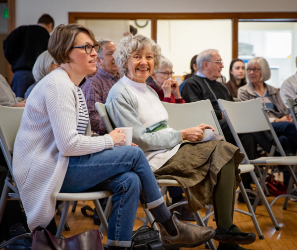 Members of congregation in adult education, with coffee and notes